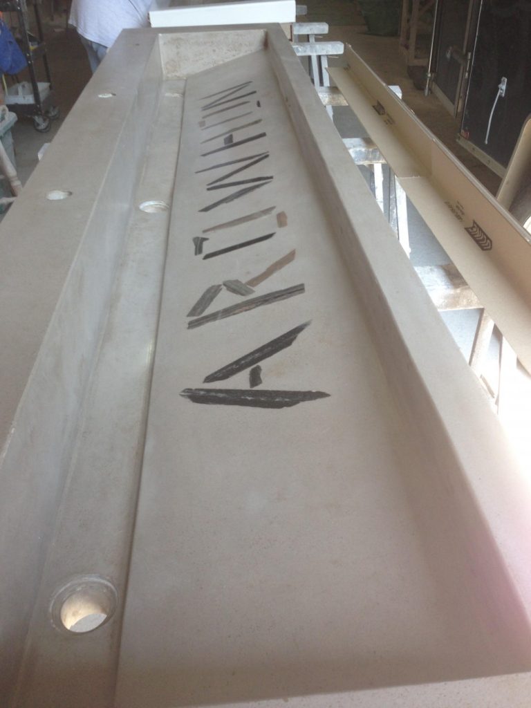 Through sink with stone inlays